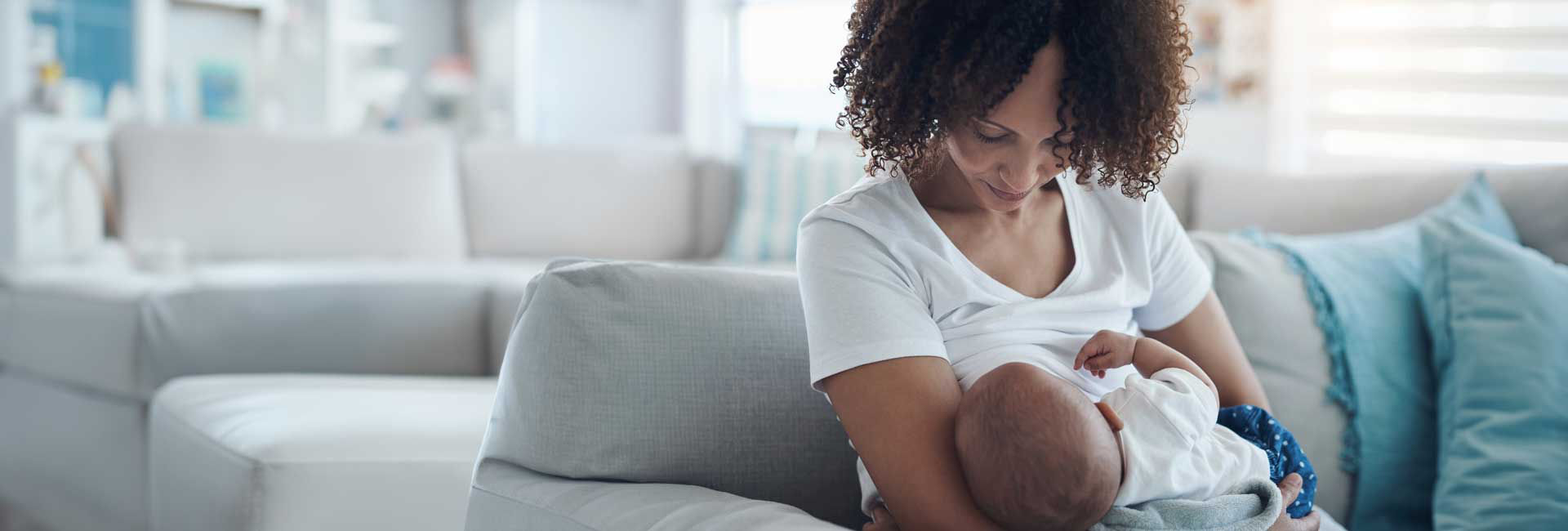 Mom and her baby on the couch